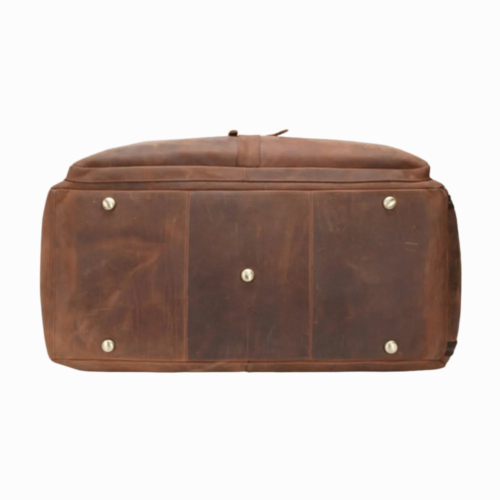 Brown leather genuine vintage bag with gold studs on a white background