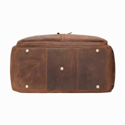 Brown leather genuine vintage bag with gold studs on a white background