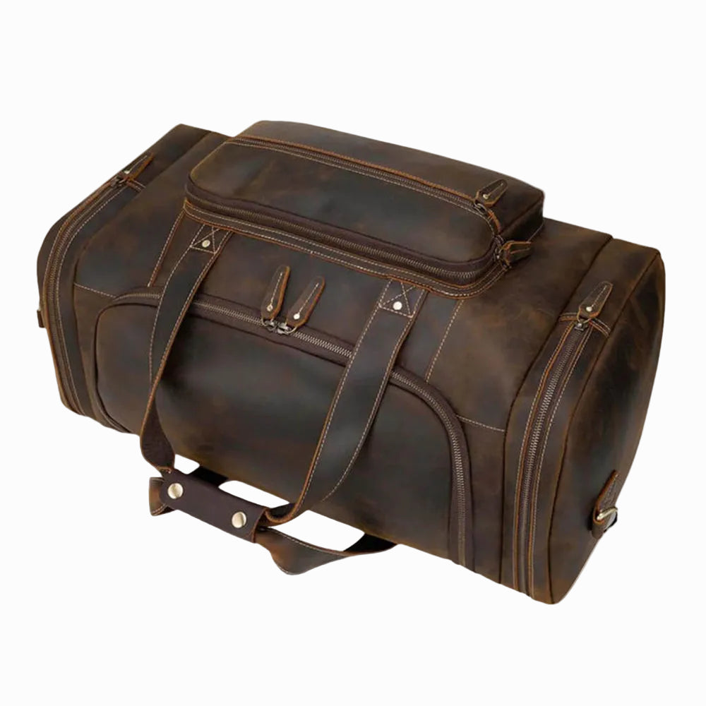 Brown leather duffel bag for travel on a white background