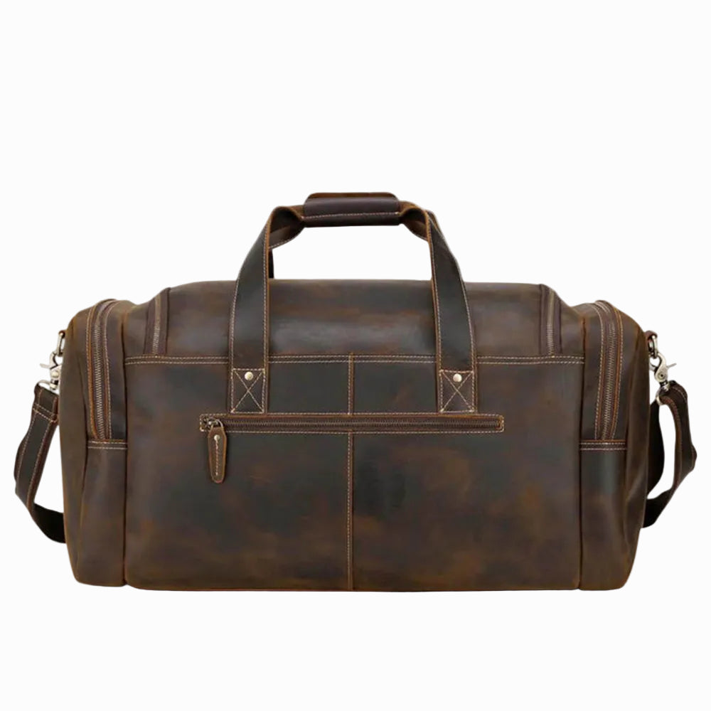 vintage Brown leather duffel bag on a white background