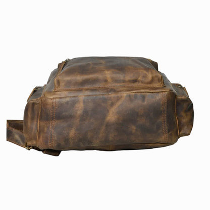 distressed Brown vintage Brown leather backpack on a white background