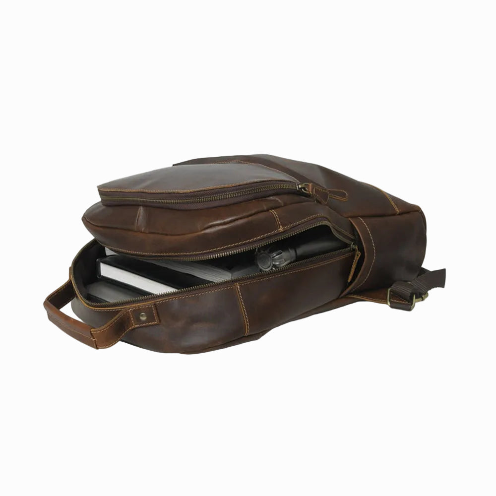 vintage distressed unisex sheepskin leather Brown leather backpack on a white background