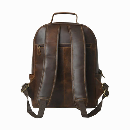 back view of vintage distressed unisex sheepskin leather Brown leather backpack on a white background