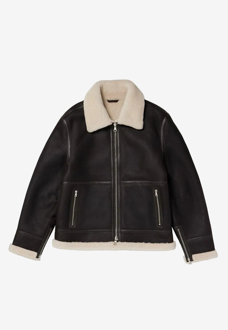 Black leather sheepskin shearling jacket with cream shearling collar and cuffs on a white background