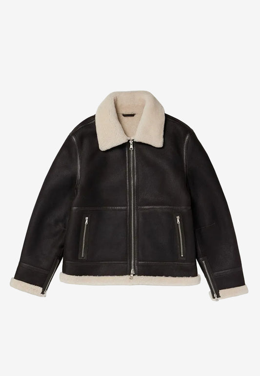 Black leather sheepskin shearling jacket with cream shearling collar and cuffs on a white background