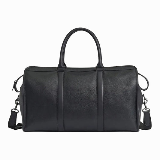Black leather duffel bag  for travel and gym on a light background
