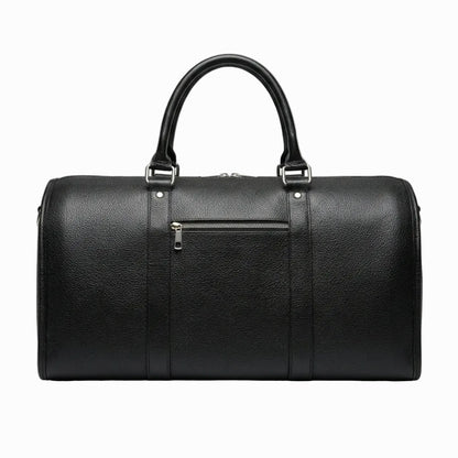 vintage Black leather duffel bag on a light color background