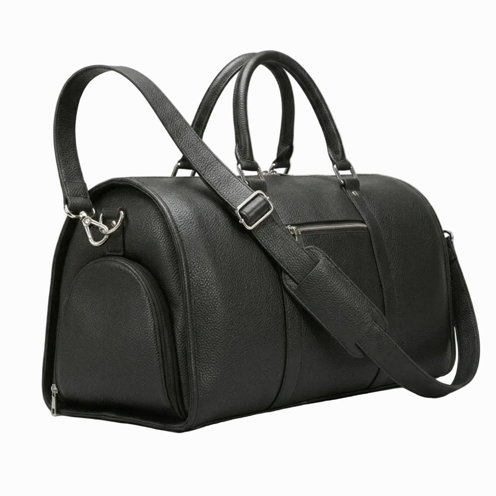 Black leather duffel bag with a shoulder strap on a light background