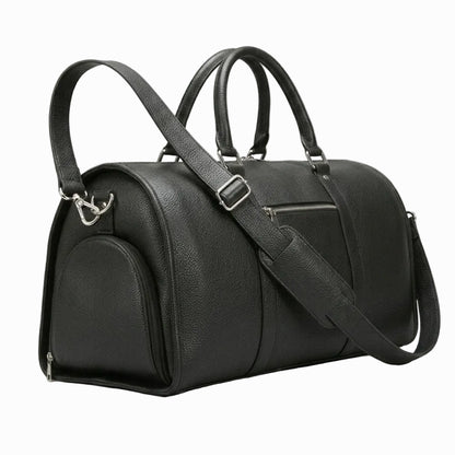 Black leather duffel bag with a shoulder strap on a light background