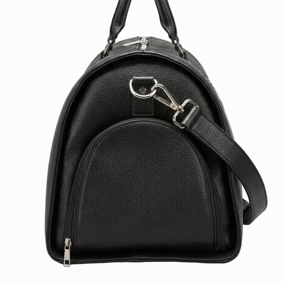Vintage Black leather duffle bag with a shoulder strap on a light background