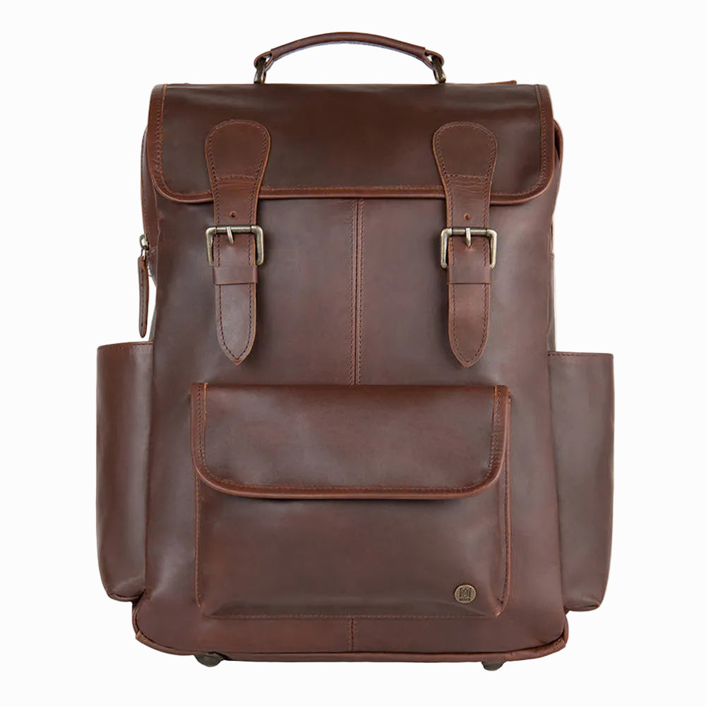 Brown sheepskin leather backpack with multiple pockets on a white background