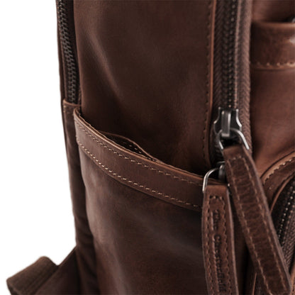 Close-up of a Vintage Handmade brown Sheepskin Leather backpack with a zipper pocket.